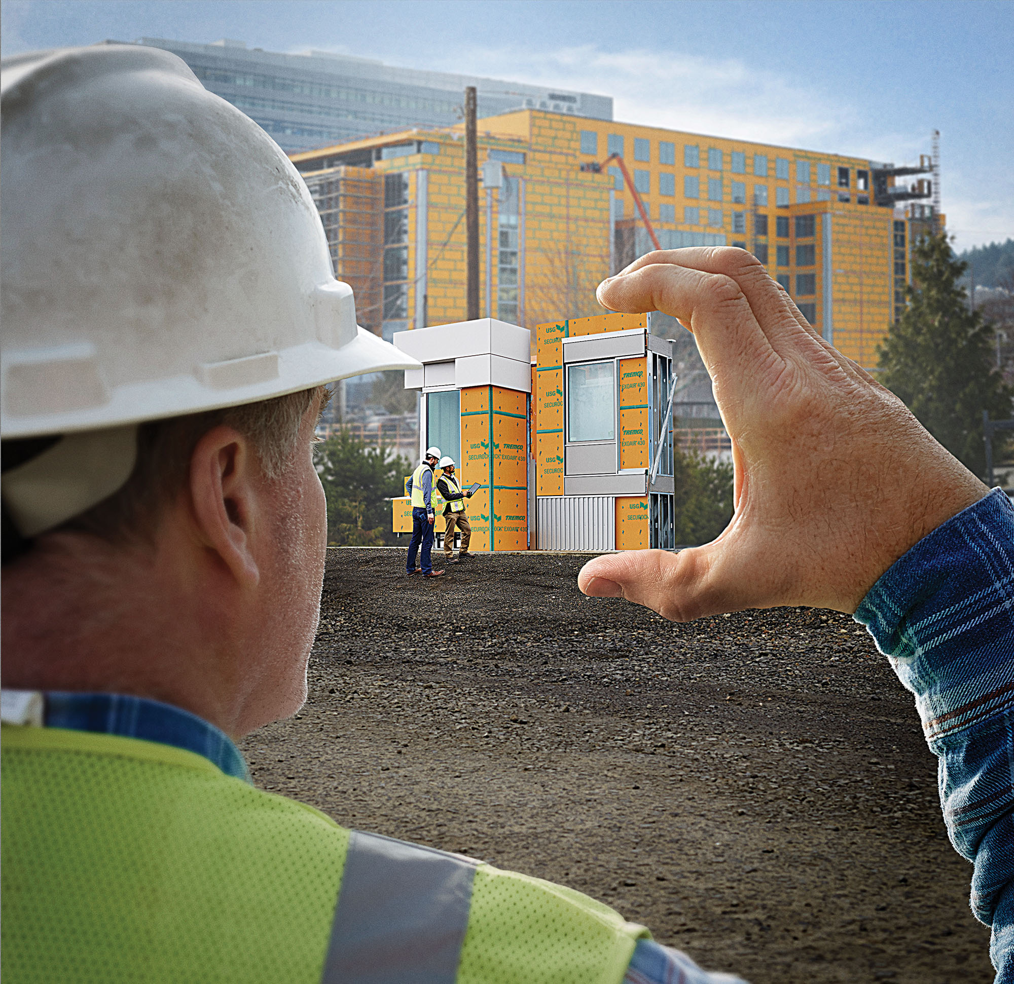 installer holding render of wall panels