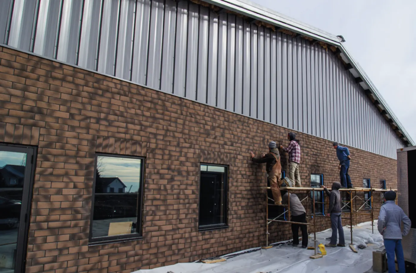 An energy-efficient combination of Insulated Concrete Forms and NewBrick for this factory's addition. 